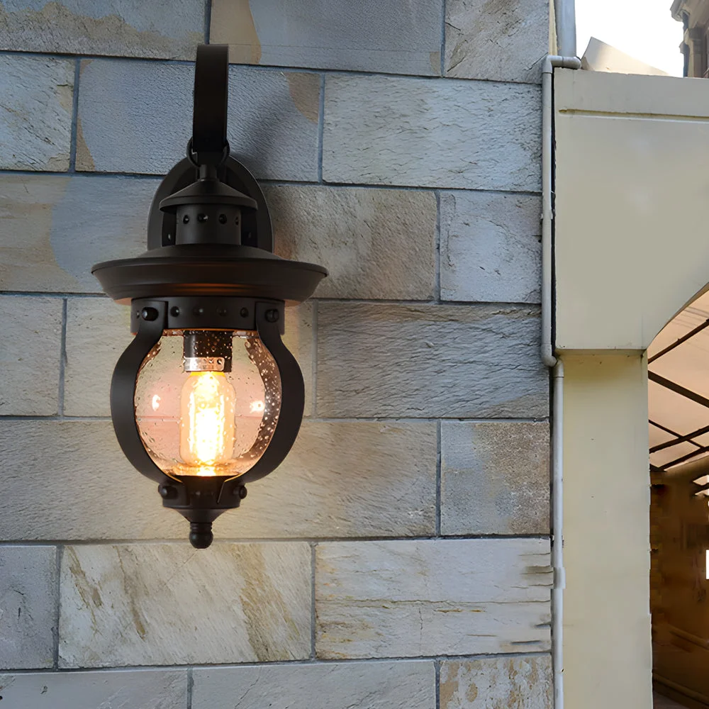 Recyclable 1-Light Seeded Glass Globe LED Outdoor Wall Lantern with Curved Arm Elite